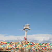 we also found an enchanted world full of snow-capped mountains, lush valleys dotted by Nomadic tribesmen’s tents, and colorful Buddhist monasteries.