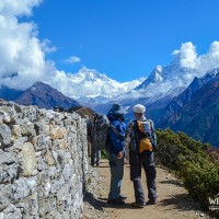 Trekkers looking the Everest range and Aama Deblam mountain range from Shyangboche