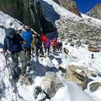 D9.13 Trekkers walking through the snow trail while crossing the Chola Pass. Windhorse Tours