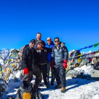 D9.7 Tourist taking photographs on top of the chola pass Windhorse Tours