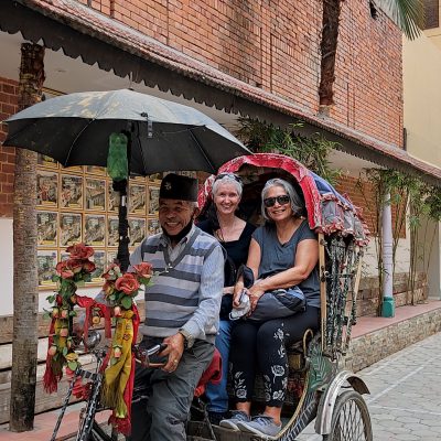 Guests taking a rickshaw ride Windhorse Tours