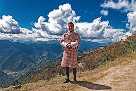 How do you dress in Bhutan and what kind of dress code is expected of visitors? 2 Windhorse Tours Men in traditional dress Windhorse Tours